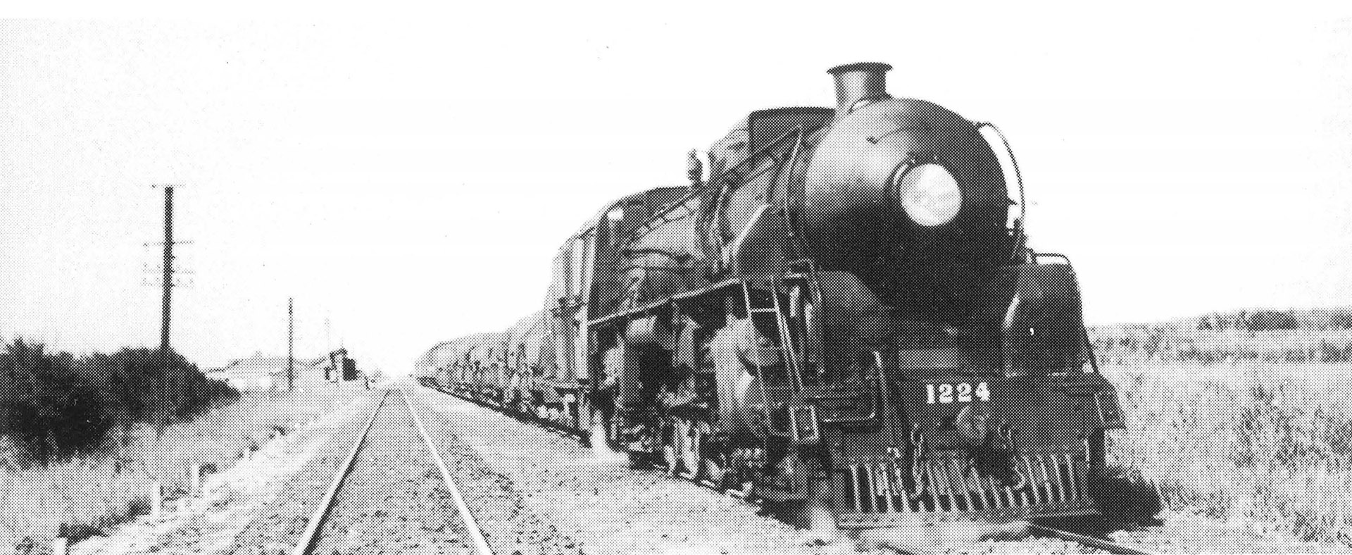 'J' locomotive hauling a mixed train through Eureka