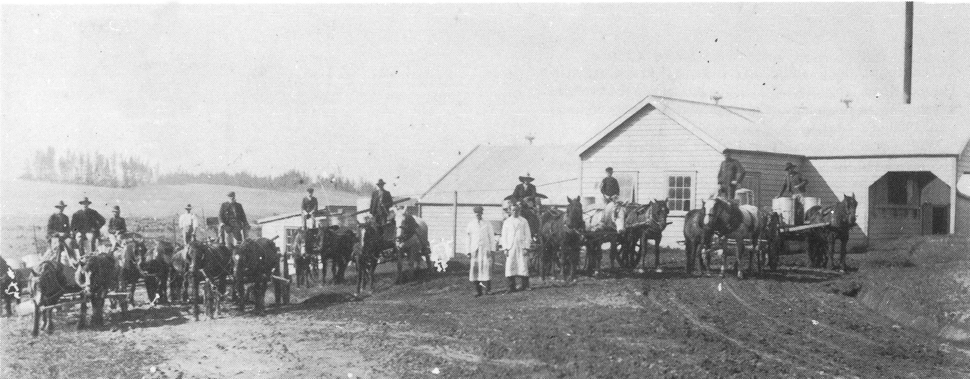 Mr Jackways and his First Assistant, Mr Campbell, outside the original Eureka Dairy Company's factory with some of the early suppliers in 1904.